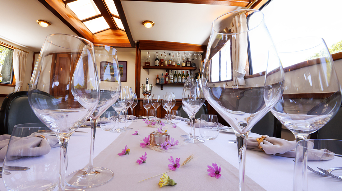 Beautiful dining setting on Anjodi on the Canal du Midi