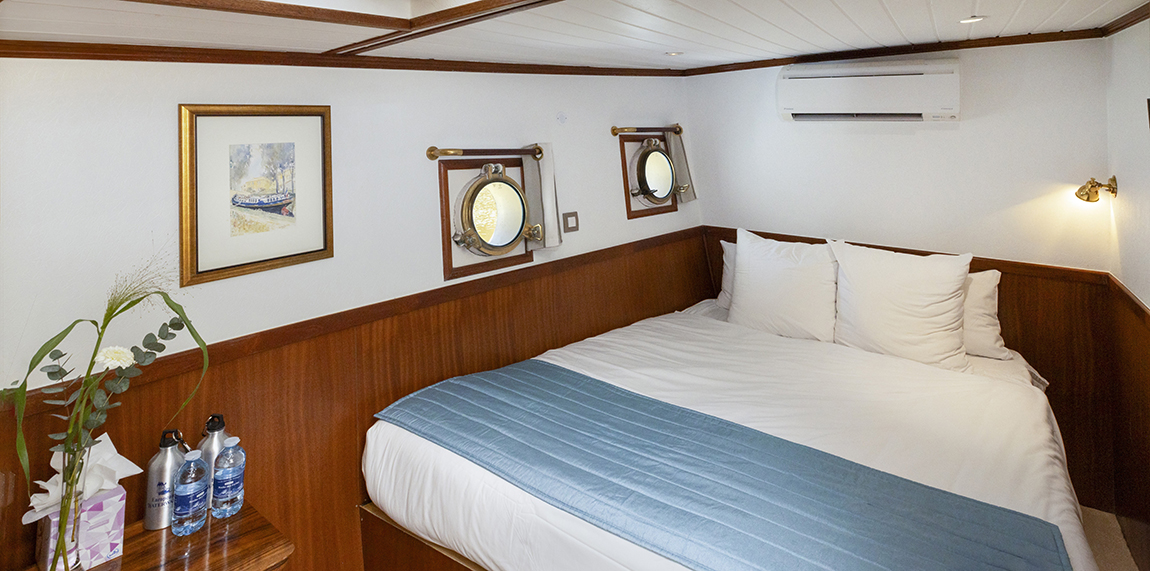 Well-appointed stateroom on board hotel barge Anjodi