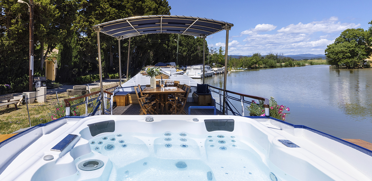 Beautiful sunny deck area on hotel barge Anjodi