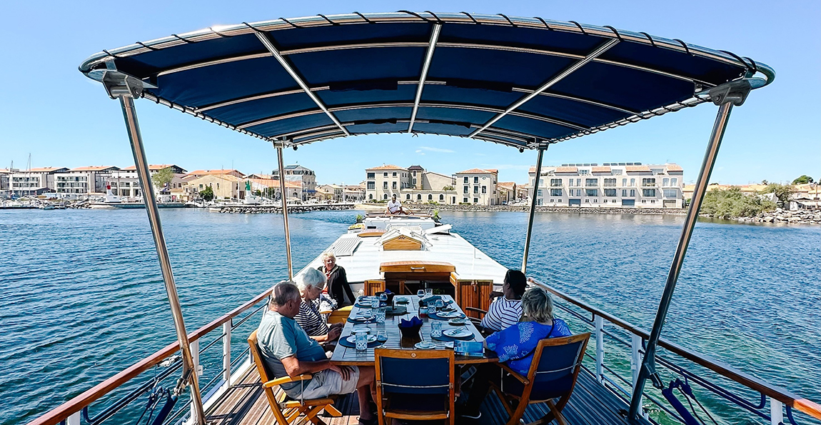 Spacious shaded deck area on hotel barge Anjodi