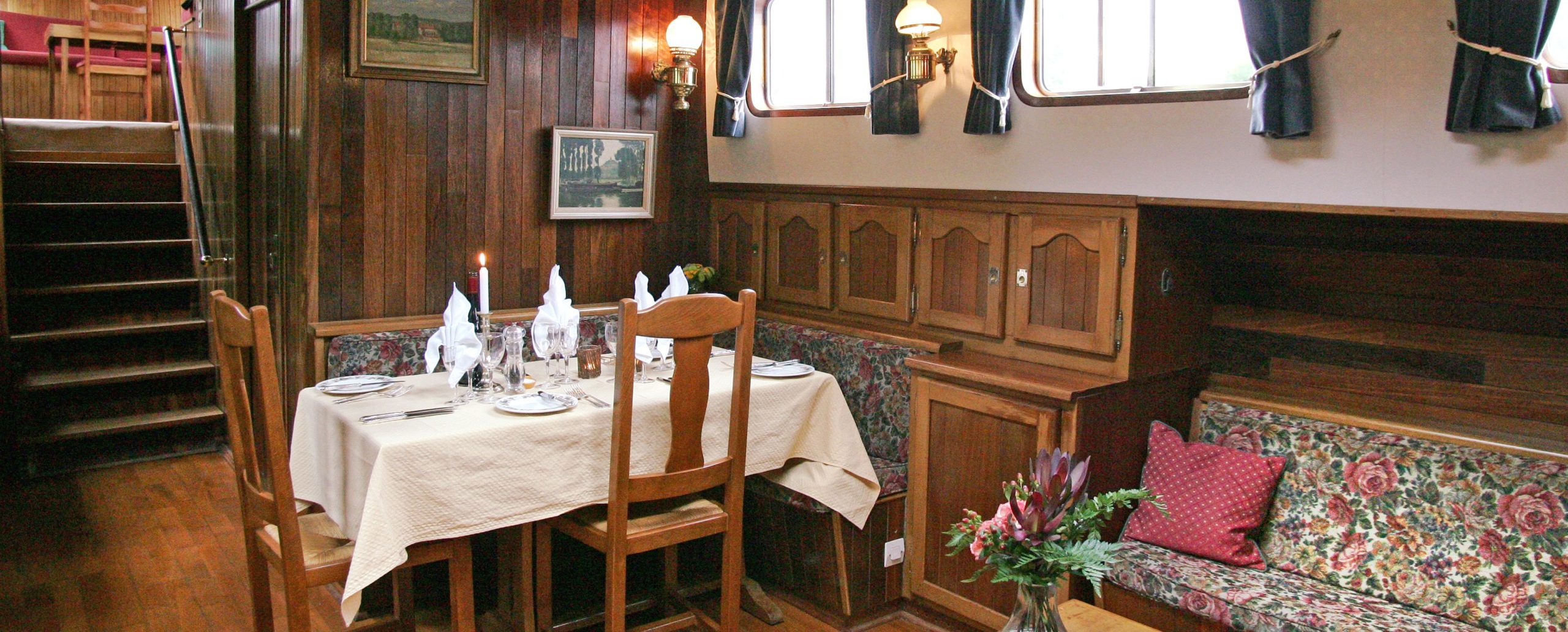 Guests enjoy the wonderful cuisine of Brittany on board hotel barge Nymphea